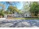 Charming single-story home with a covered porch, attached garage and lovely landscaped yard at 1706 W Avalon Cir, Charleston, SC 29407