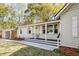 Inviting front porch with seating, perfect for relaxing and enjoying the outdoors at 1706 W Avalon Cir, Charleston, SC 29407