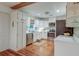 Bright kitchen with stainless steel appliances, white cabinetry, and wooden floors at 1706 W Avalon Cir, Charleston, SC 29407