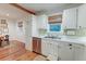 Bright kitchen with white cabinets, stainless steel appliances, and natural light at 1706 W Avalon Cir, Charleston, SC 29407