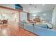 Open-concept living area with wood floors, exposed beams, and modern decor at 1706 W Avalon Cir, Charleston, SC 29407