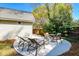 Inviting outdoor patio with seating, perfect for entertaining or relaxing in a serene backyard setting at 1706 W Avalon Cir, Charleston, SC 29407