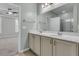 Bathroom with double sinks, large mirror, and tiled flooring with view to main bedroom at 1808 Chauncys Ct, Mount Pleasant, SC 29466