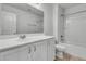 This bathroom features white cabinetry, modern fixtures and a shower and tub combination at 1808 Chauncys Ct, Mount Pleasant, SC 29466
