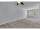 This bright bedroom has light blue walls, carpet flooring, a ceiling fan and a window at 1808 Chauncys Ct, Mount Pleasant, SC 29466