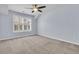 This cozy bedroom has light blue walls, carpet flooring, a ceiling fan and a window at 1808 Chauncys Ct, Mount Pleasant, SC 29466