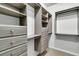 Walk-in closet with modern custom gray shelving, drawers, and multiple hanging racks at 1808 Chauncys Ct, Mount Pleasant, SC 29466