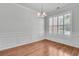 Formal dining room featuring hardwood floors, and large, bright window at 1808 Chauncys Ct, Mount Pleasant, SC 29466