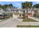 View of several colorful townhomes with garages and driveways at 1808 Chauncys Ct, Mount Pleasant, SC 29466