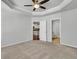 Spacious main bedroom featuring neutral walls and carpets with ceiling fan and ensuite bathroom at 1808 Chauncys Ct, Mount Pleasant, SC 29466