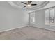 Carpeted primary bedroom featuring trey ceiling, ceiling fan, and plantation shuttered windows at 1808 Chauncys Ct, Mount Pleasant, SC 29466
