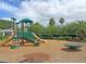 Community playground with slides, play equipment, and natural surroundings at 1808 Chauncys Ct, Mount Pleasant, SC 29466