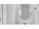 Powder room with an oval mirror, single vanity, and modern fixtures at 1808 Chauncys Ct, Mount Pleasant, SC 29466