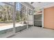 Relaxing screened porch with a view of the stone patio and wooded backyard at 1808 Chauncys Ct, Mount Pleasant, SC 29466