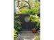 Private backyard with decorative fence, lush greenery, and a serene, secluded feel at 1810 Fleming Woods Rd, Charleston, SC 29412
