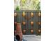 The backyard features a dark fence with potted plants and a fire pit at 1810 Fleming Woods Rd, Charleston, SC 29412