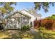View of backyard outbuilding with stone pathway and mature landscaping creating a private and peaceful outdoor space at 1810 Fleming Woods Rd, Charleston, SC 29412