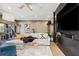 Finished basement with exercise equipment, a large sectional sofa, and a modern entertainment center at 1810 Fleming Woods Rd, Charleston, SC 29412