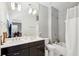 Contemporary bathroom featuring double vanity, modern lighting, and a shower-tub combination at 1810 Fleming Woods Rd, Charleston, SC 29412