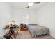 Cozy bedroom with a workspace desk, window providing natural light, and ceiling fan at 1810 Fleming Woods Rd, Charleston, SC 29412