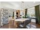 Elegant dining space open to a stylish living room with a brick fireplace and plenty of natural light at 1810 Fleming Woods Rd, Charleston, SC 29412