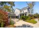 Beautiful two-story home with an attached garage and manicured landscaping including a driveway and sidewalk at 1810 Fleming Woods Rd, Charleston, SC 29412