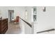 Bright hallway with natural light from windows and chair adding a touch of character at 1810 Fleming Woods Rd, Charleston, SC 29412