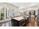 Modern kitchen island featuring a stainless steel sink and microwave, with access to a sunny backyard at 1810 Fleming Woods Rd, Charleston, SC 29412