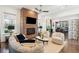 Stylish living room featuring a brick fireplace, comfortable seating, and an open layout for entertaining at 1810 Fleming Woods Rd, Charleston, SC 29412