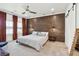 Spacious main bedroom with elegant accent wall, ceiling fan, and ample natural light at 1810 Fleming Woods Rd, Charleston, SC 29412