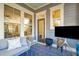 Bright sunroom with plush seating, a view of the staircase, and natural light at 1810 Fleming Woods Rd, Charleston, SC 29412