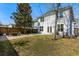 Spacious backyard with a wooden fence, a stone patio with outdoor furniture, and an expansive grassy area at 1826 Towne St, Johns Island, SC 29455