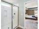 Walk-in shower with subway tile, next to a bedroom with tray ceiling at 1826 Towne St, Johns Island, SC 29455