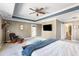 Relaxing primary bedroom with tray ceiling, sitting area, and outdoor access at 1826 Towne St, Johns Island, SC 29455