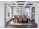 Cozy dining room with a view of the front yard, featuring a large table and stylish decor at 1826 Towne St, Johns Island, SC 29455