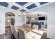 Elegant dining area with coffered ceilings and stylish chandelier, adjacent to the open-concept living spaces at 1826 Towne St, Johns Island, SC 29455