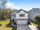 Beautiful two-story home with a two-car garage, stone accents, a balcony, and well-maintained landscaping at 1826 Towne St, Johns Island, SC 29455