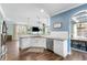 Bright open kitchen with modern appliances and an adjacent living area, perfect for entertaining at 1826 Towne St, Johns Island, SC 29455