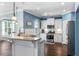 Modern kitchen with stainless steel appliances, granite countertops, and an adjacent dining area at 1826 Towne St, Johns Island, SC 29455