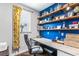 Stylish home office with a rustic desk, open shelving, and ample natural light at 1826 Towne St, Johns Island, SC 29455