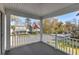 Open-air porch overlooking the streetscape with American flag flying at 1826 Towne St, Johns Island, SC 29455