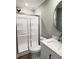 Modern bathroom featuring a shower and vanity with round mirror at 1848 Merrick Dr, Round O, SC 29474