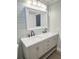 Bathroom featuring a double vanity with light gray cabinets and marble countertops at 1848 Merrick Dr, Round O, SC 29474