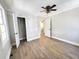 Bedroom featuring wood-look floors, closet, ceiling fan, and neutral paint, providing a relaxing atmosphere at 1848 Merrick Dr, Round O, SC 29474