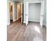 Bright bedroom featuring wood-look floors and a closet with white doors at 1848 Merrick Dr, Round O, SC 29474