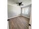 Neutral bedroom with ceiling fan, and wood-look floors at 1848 Merrick Dr, Round O, SC 29474