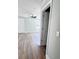 Open bedroom featuring light-blue walls, wood-look floors, and a ceiling fan at 1848 Merrick Dr, Round O, SC 29474