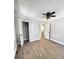 Bedroom with wood-look floors, ceiling fan, and closet for storage, offering a comfortable living space at 1848 Merrick Dr, Round O, SC 29474