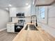 Modern kitchen with stainless steel appliances, butcher block countertops, and stylish fixtures at 1848 Merrick Dr, Round O, SC 29474