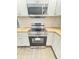 Modern kitchen featuring stainless steel appliances and bright white cabinets at 1848 Merrick Dr, Round O, SC 29474